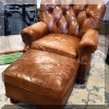 F41. Leather chair and ottoman. 